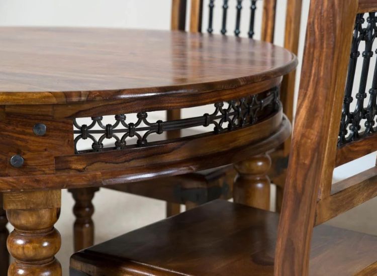 Close-up view of Sheesham wood table and chair in an interior setting, highlighting the rich grain, finish, and elegant design elements.