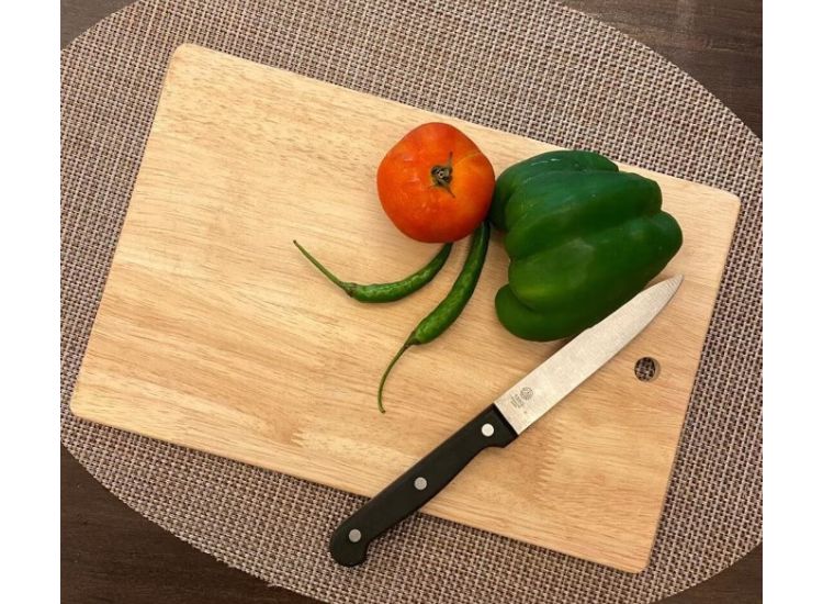 Rubberwood chopping board designed for vegetables and fruits, featuring a smooth surface and natural finish, perfect for kitchen prep.