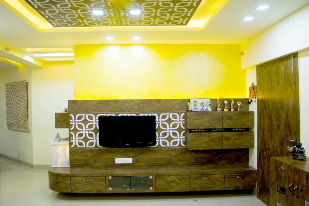 Living room TV unit design with Puja unit behind in Magarpatta Hadapsar Pune
