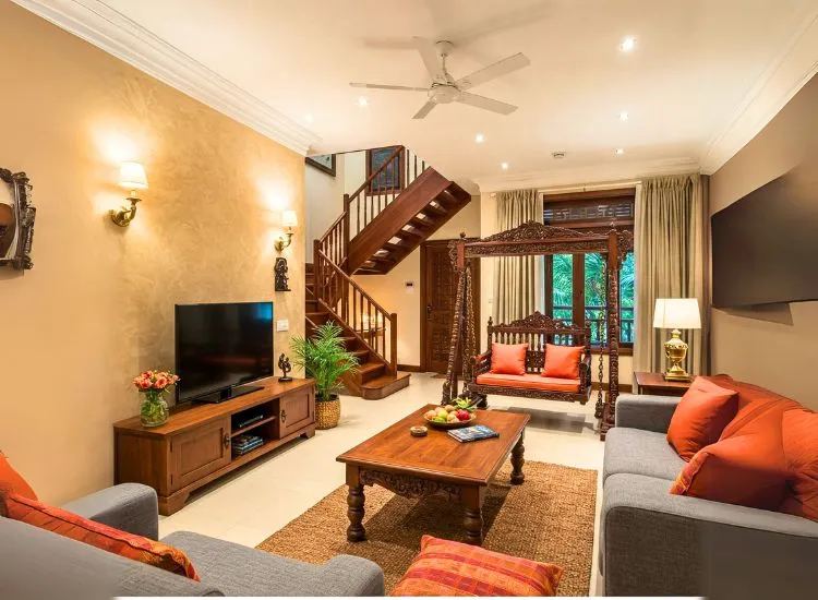 Living room design idea that transitions like a pro—classic furniture meets modern accents, all while sipping a cup of sophistication.