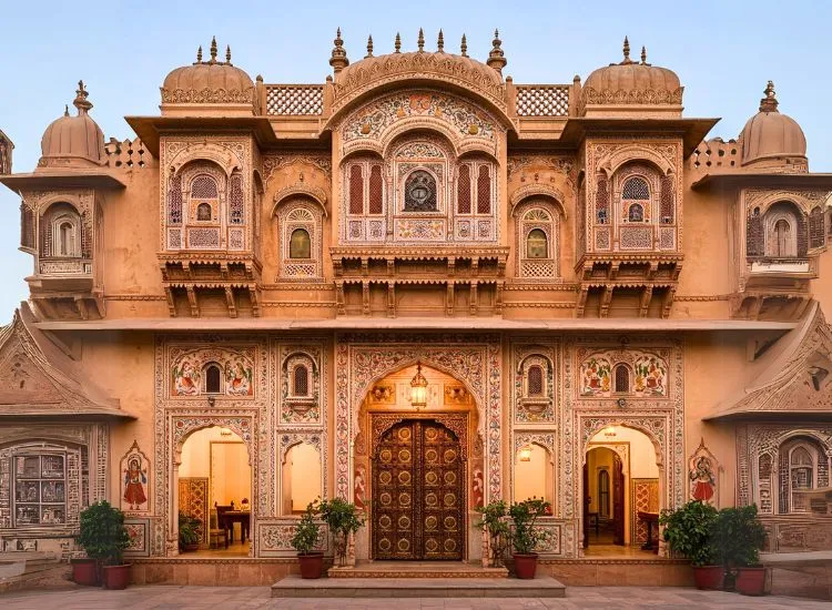 Discover the elegance of Rajasthani Haveli-style house front design! Embrace intricate front elevation and Indian architectural charm.