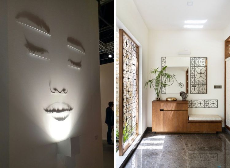 A home foyer in sunlight and shadows and wall spotlight illuminating a woman face artwork