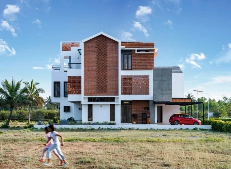 Exposed brick exterior of a modern home, blending rustic charm with contemporary design for an inviting facade.