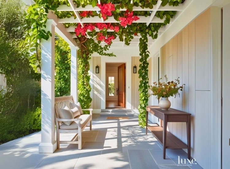 Trellis-covered porch enhancing home entrance design, providing shade, style, and a natural touch to the house entrance while promoting a welcoming atmosphere.