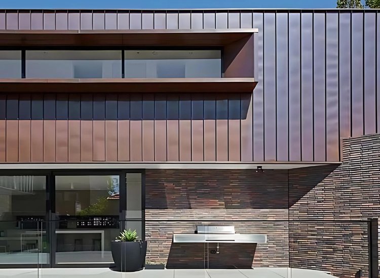 Distinctive copper sheet exterior on a house, offering a sleek, modern look that evolves with time and adds architectural interest.