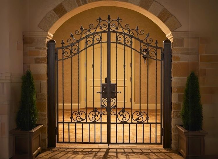 Stunning iron gate with antique finish adds timeless elegance to home gate design and enhances house entrance design.