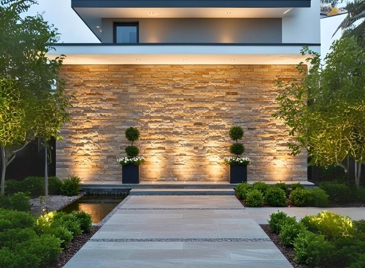 Stunning natural stone cladding wall enhances house entrance design with a rustic, textured look for entryway decor.