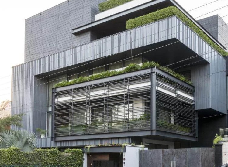 Contemporary zinc sheet and bar facade on a house, featuring a sleek finish and industrial appeal that enhances modern architecture.