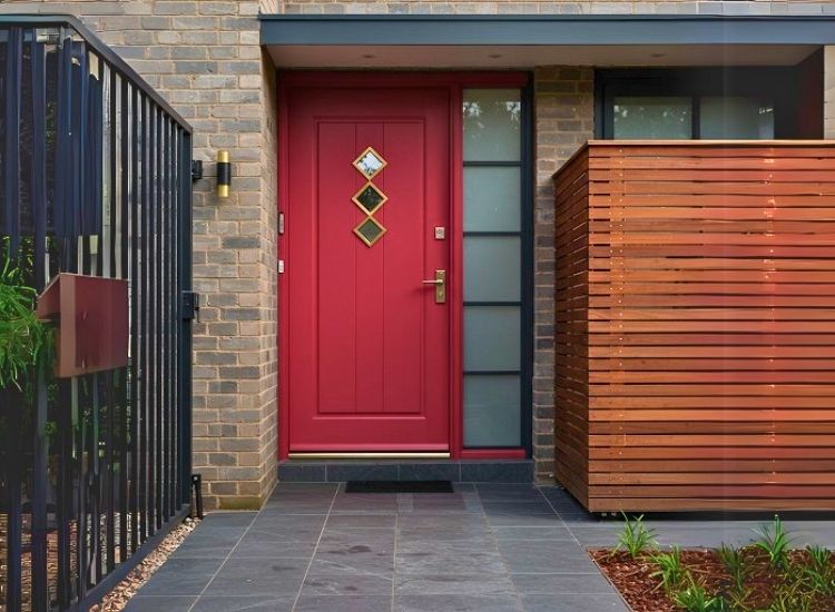 Statement front door color adding bold personality and charm to home entrance design, creating a striking focal point for the house entrance.