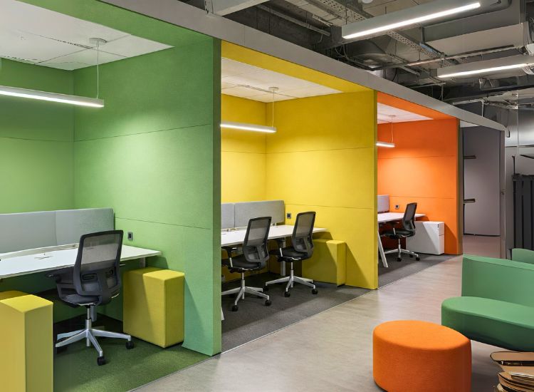 Modern office interior design utilizing color psychology to enhance focus and productivity in small office spaces, with vibrant yet balanced interior design in office.