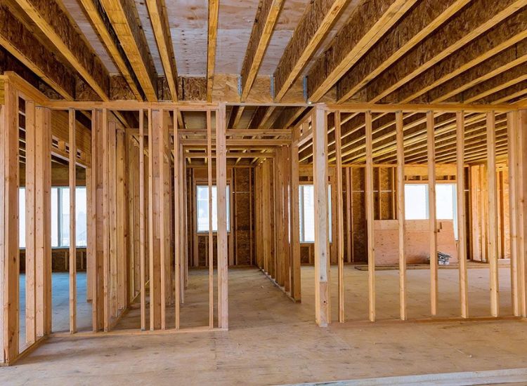 A room with wooden framing and structural plywood load bearing walls