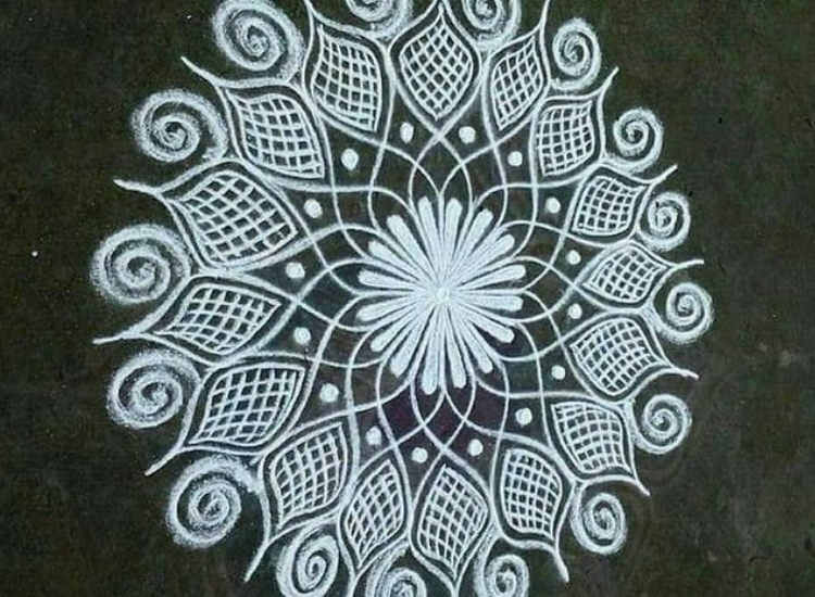 mandala rangoli featuring symmetrical designs and detailed motifs, adding a touch of elegance to festive celebrations