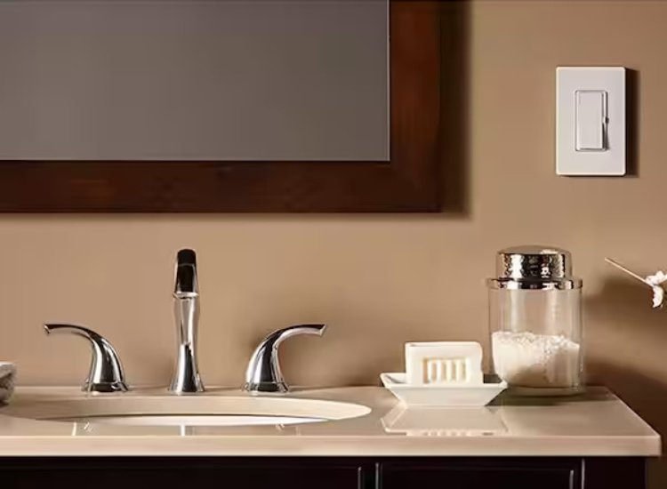 A bathroom vanity with a mirror and sink, featuring dimmer switches for adjustable lighting level to suit moods and activities