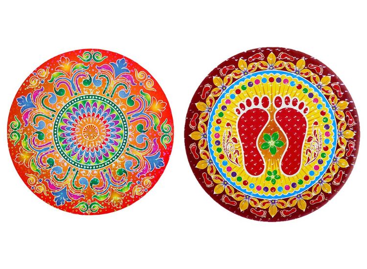 Two distinct rangoli sticker designs: one showcasing a traditional rangoli pattern and the other featuring the footprints of Laxmi Devi.