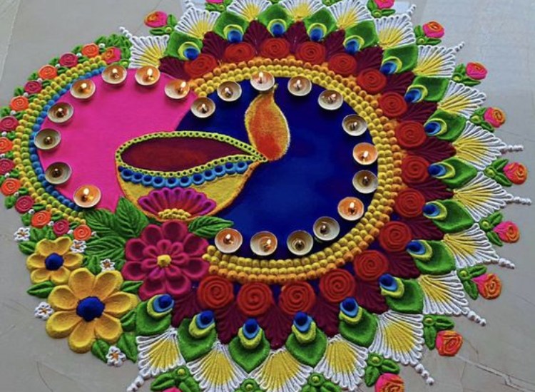 Intricate colorful rangoli made with bright powders and flowers, adding charm to the festive decor