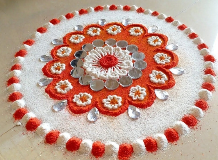 Elegant mirror rangoli design featuring reflective elements that shimmer and enhance the festive ambiance