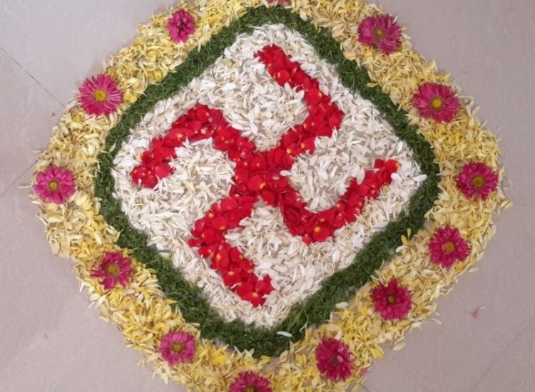rangoli design of a swastick, featuring vibrant colors and intricate patterns that celebrate beauty and grace