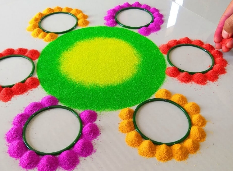 Home tool bangle rangoli featuring creative patterns made from colorful bangles, adding a unique and festive touch to decor.