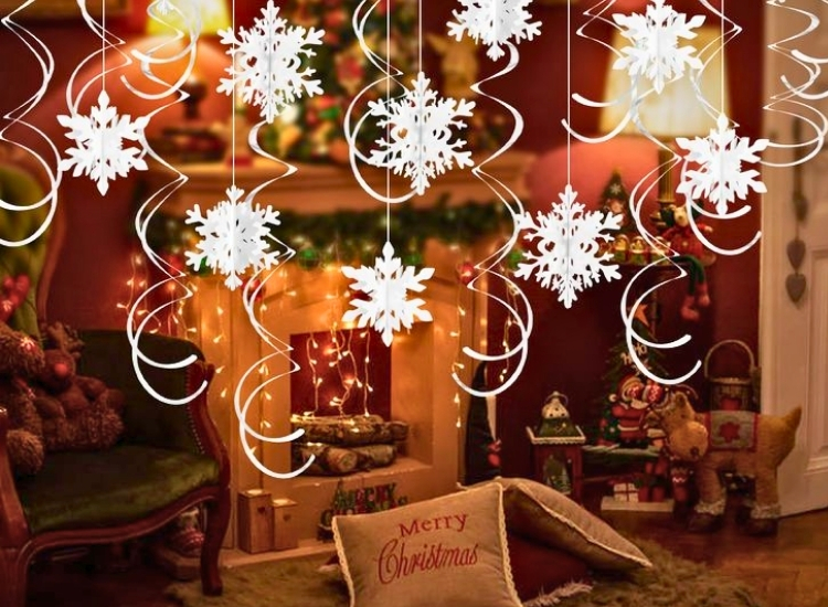 "Paper snowflakes hanging from the ceiling create a winter wonderland. christmas tree png adds to the festive feel."