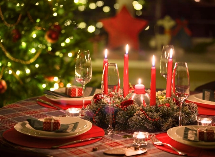 "Plaid or holiday-themed tablecloth adds festive flair to the dining table. christmas tree picture complements the setting."