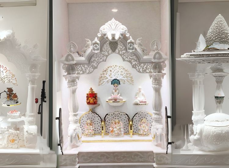 17. Marble Pooja Room With Floral Motifs