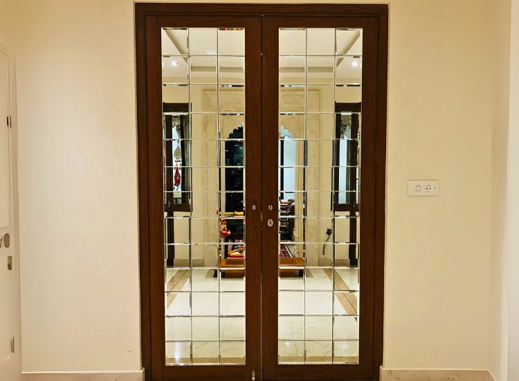 18. Pooja Room Door Design With Glass And Mirror Panels