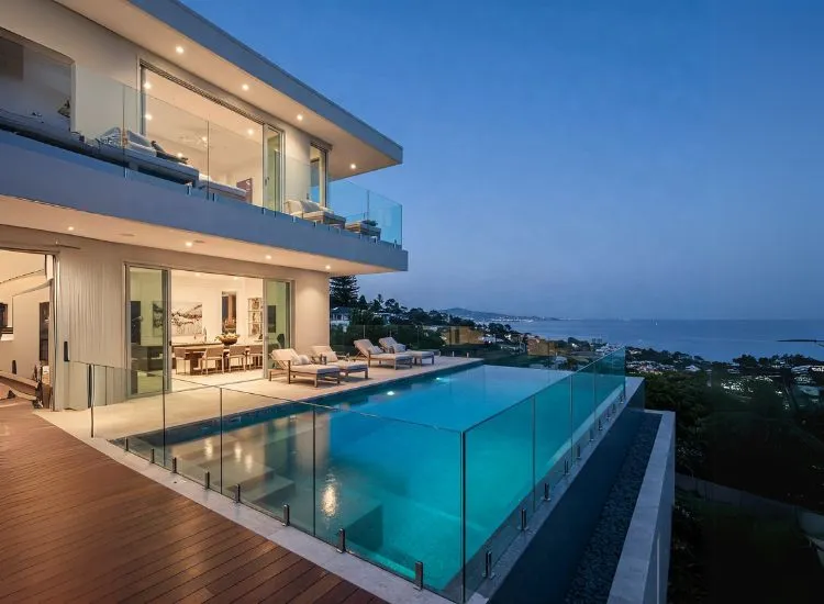A luxurious modern duplex house design featuring an elegant infinity pool, spacious duplex house interior, and stunning contemporary aesthetics.