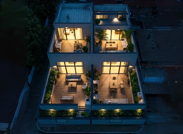 A stylish modern duplex house design featuring a spacious rooftop deck, elegant duplex house interior, and a contemporary upper floor design.