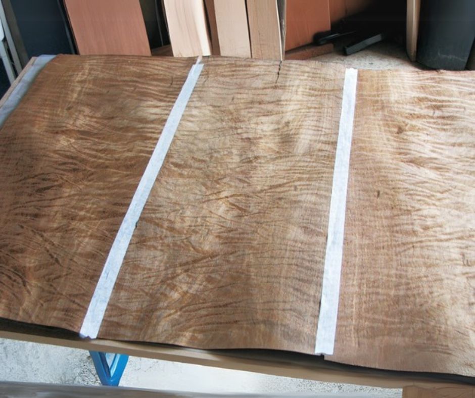 Laid-up veneer displaying pieces of raw veneer attached together to create larger pieces