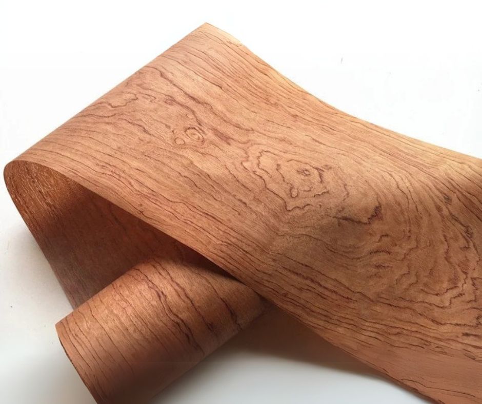 Raw wood veneer slices featuring a unique texture, and color with intricate brown lines forming a pattern