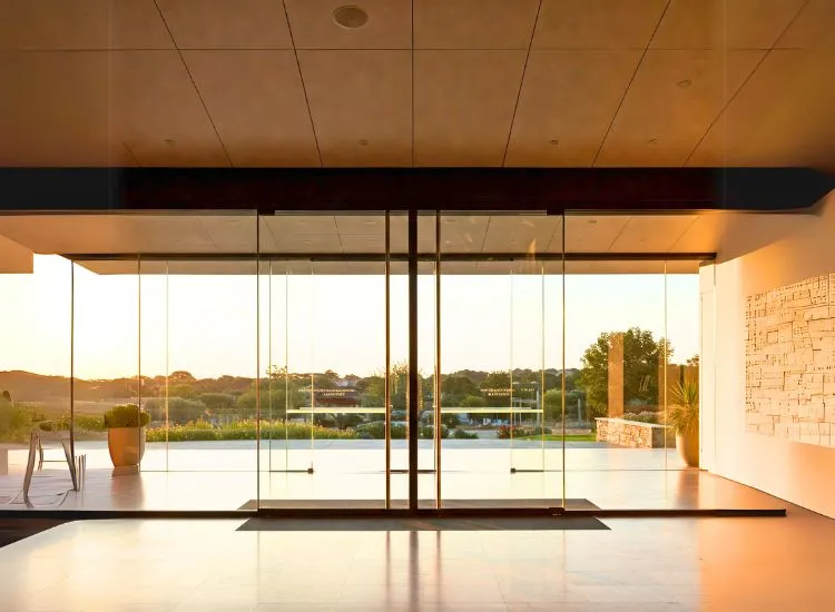 Modern glass door design adding elegance and sophistication to house door types, perfect for contemporary interior and exterior designs.