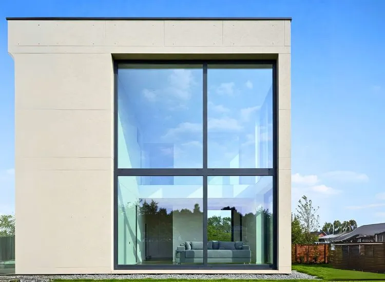 Sleek modern home with minimalist window designs, emphasizing clean lines and functional elegance for a contemporary living space.