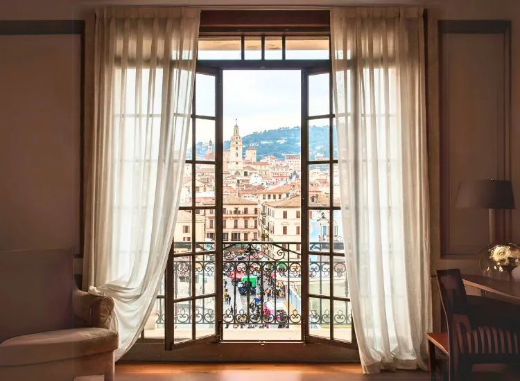 Sophisticated home with classic French windows, blending elegance and functionality for a bright and airy interior.