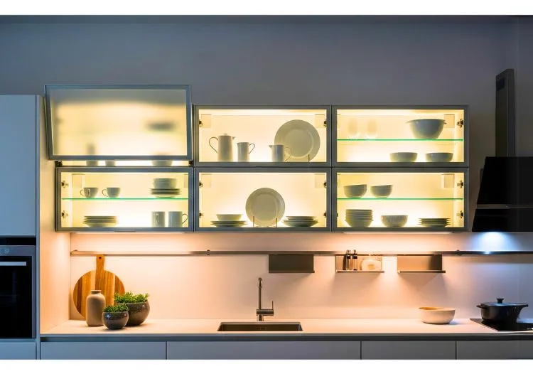 Backlit modular kitchen cabinets create luminous ambiance in modern designs for kitchen cupboards and furniture.