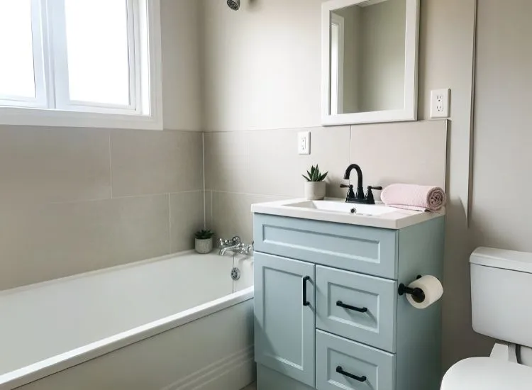 Cost-effective small bathroom design ideas that focus on refinishing tubs or vanities to save money and refresh the space.
