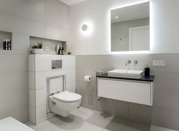 Modern small bathroom design ideas featuring wall-mounted toilets and concealed cisterns for a sleek, space-saving layout.